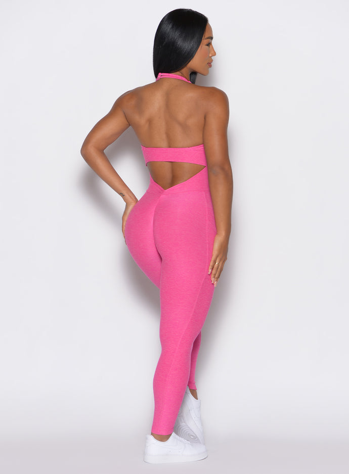 back profile view of a model wearing our Backless Pocket Bodysuit in pink glo color