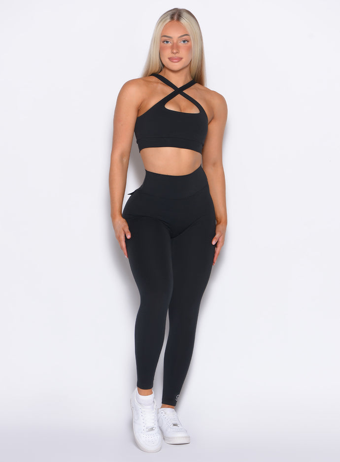 front profile view of our model in a straight pose wearing the Pocket Pop Leggings in Black color