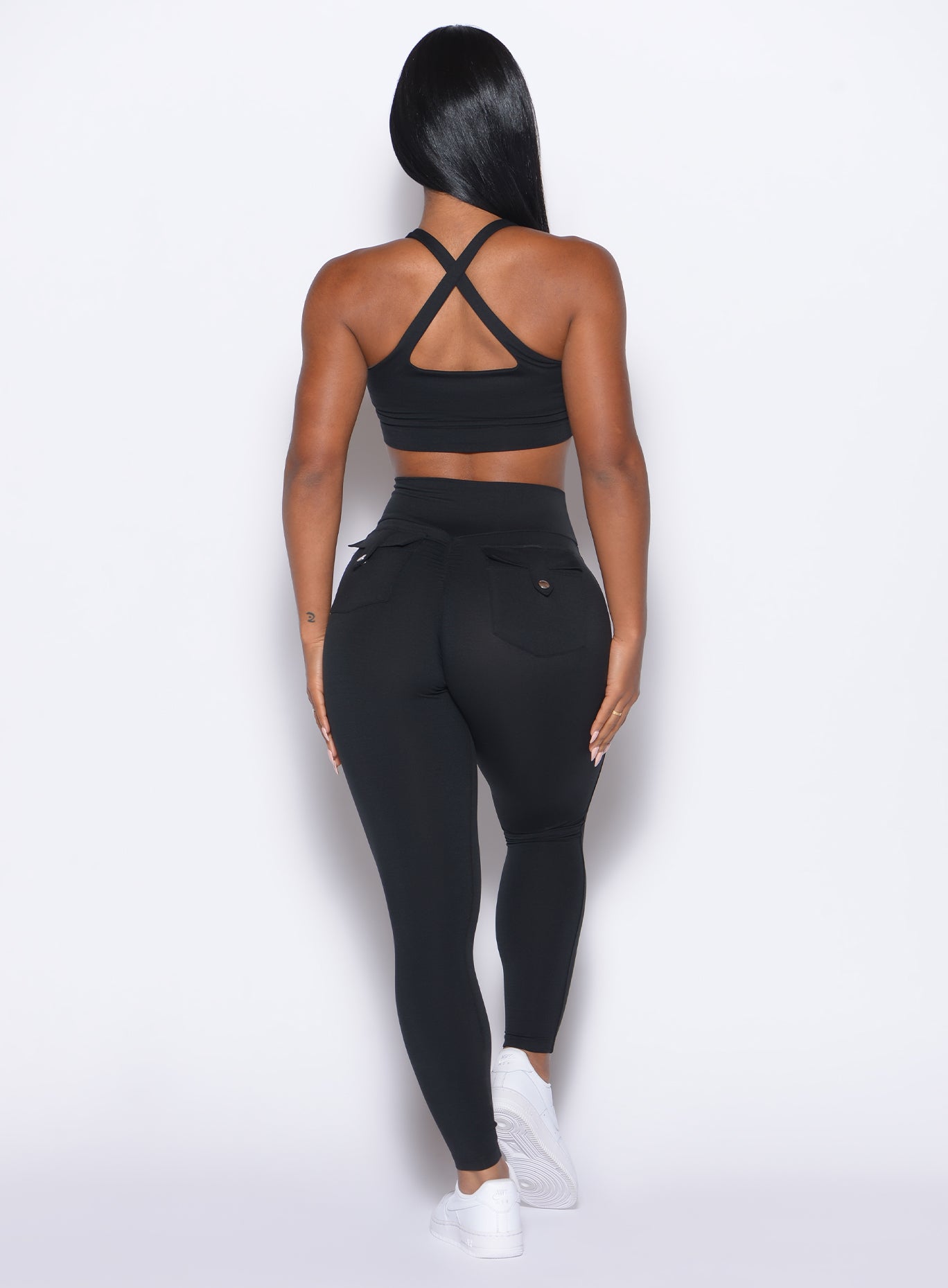 back profile view of our model wearing the Pocket Pop Leggings in Black color