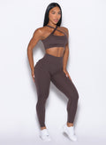 front profile picture of a model in our Seal Brown Pocket Pop Leggings 2.0 with the matching bra