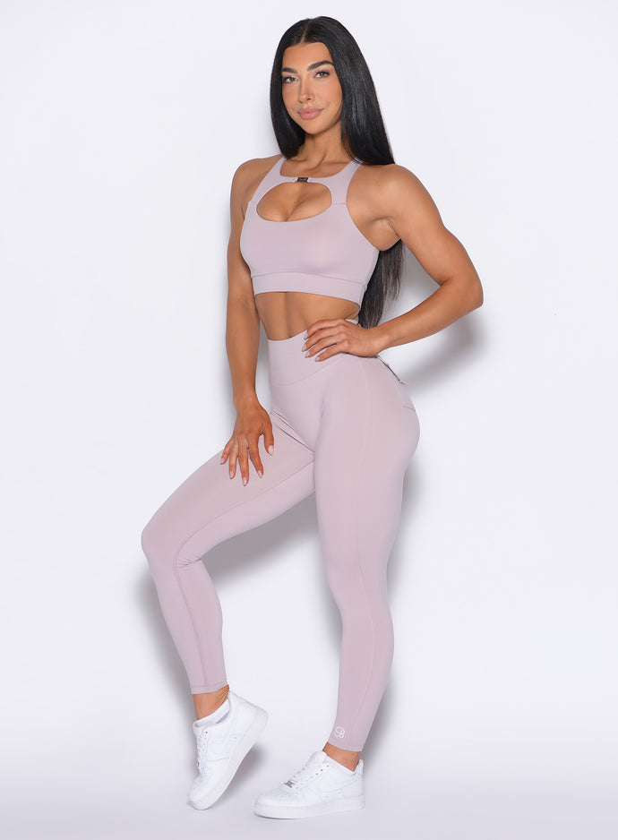 front profile picture of a model in our Pocket Pop Leggings 2.0 in Violet Ice color and the matching bra
