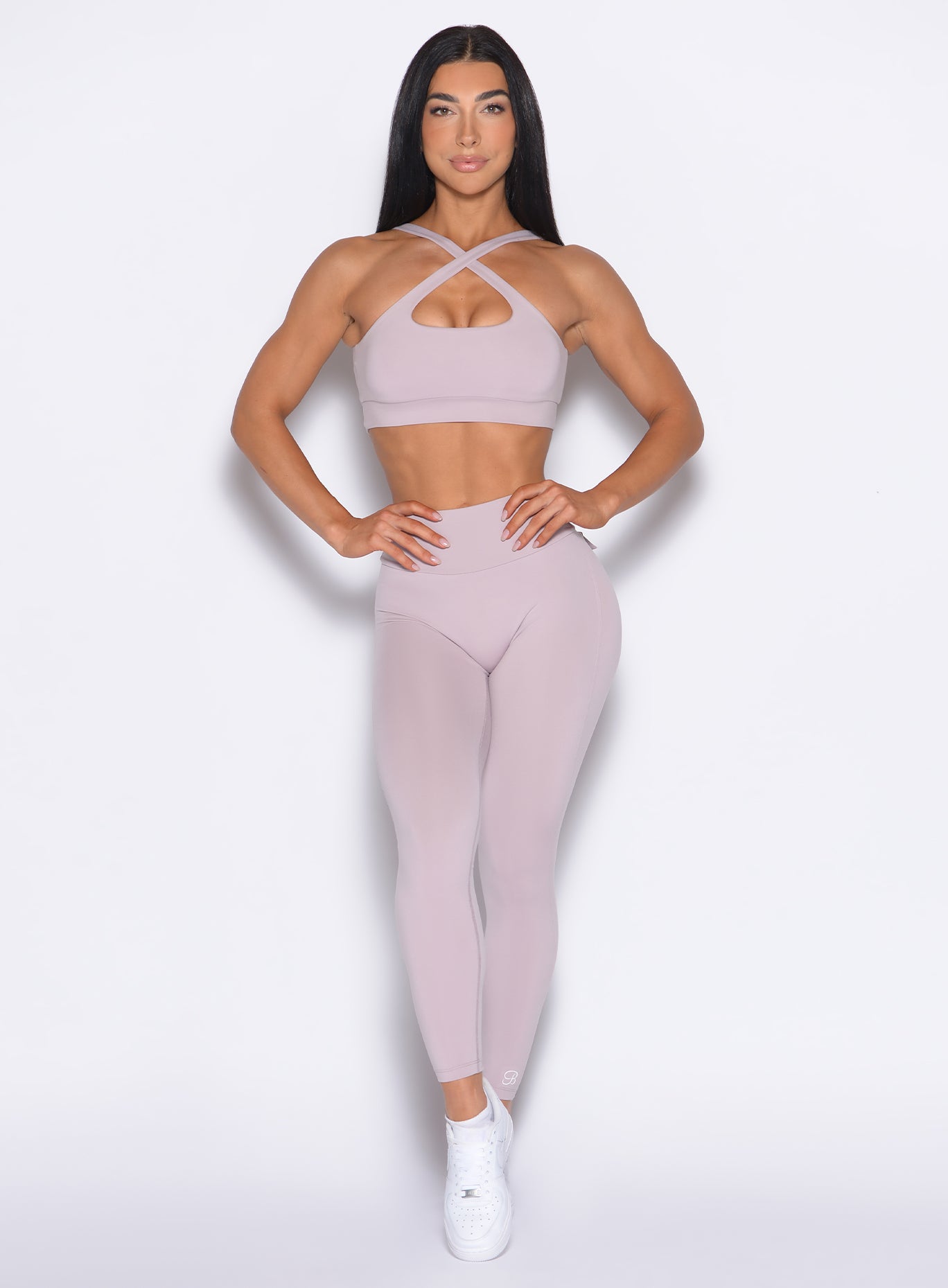 Model facing forward wearing our Pocket Pop Leggings 2.0 in Violet Ice color and the matching bra
