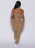 back profile picture of a model wearing our Pocket Pop Leggings in caramel color and a matching bra