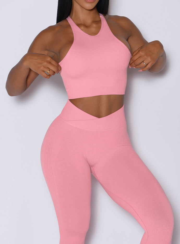 front profile picture of a model in our Lifter Heather Seamless Bra and the matching leggings in Ballerina color