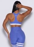 back profile picture of a model wearing our reversible tank bra in Violet Blue color along with a matching thigh high leggings