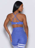 back profile picture of a model wearing our twist mini bra in violet blue color along with a matching thigh high leggings