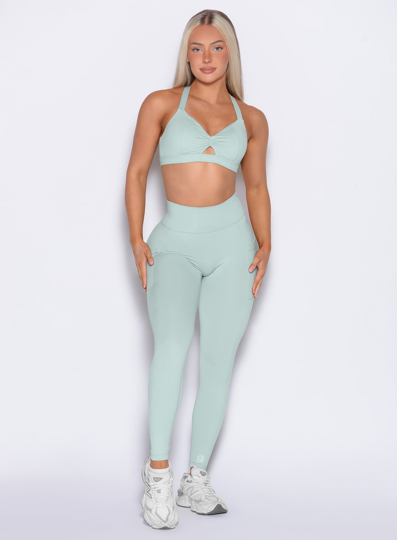 Front profile shot of our model  wearing the Define Leggings in Mist color paired with the matching bra