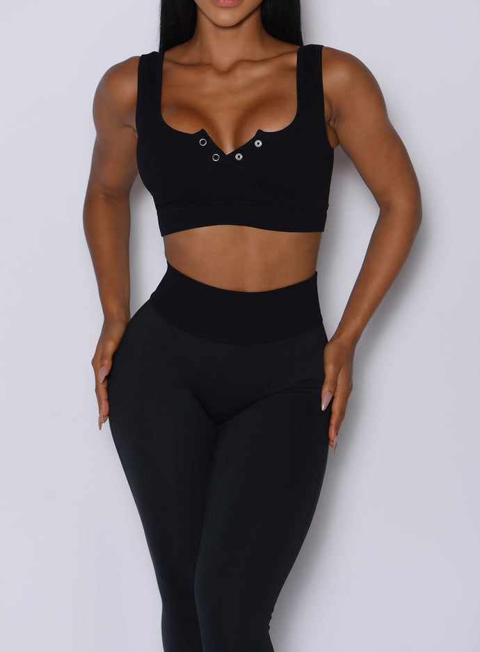 Close up front profile view of our model wearing the Figure Leggings in Black color