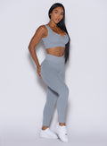 Front right side profile view of our model wearing the Figure Leggings in Carbon color