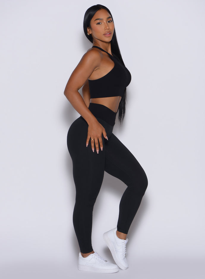 Right side profile view of our model wearing the Figure Scrunch Leggings in Black color