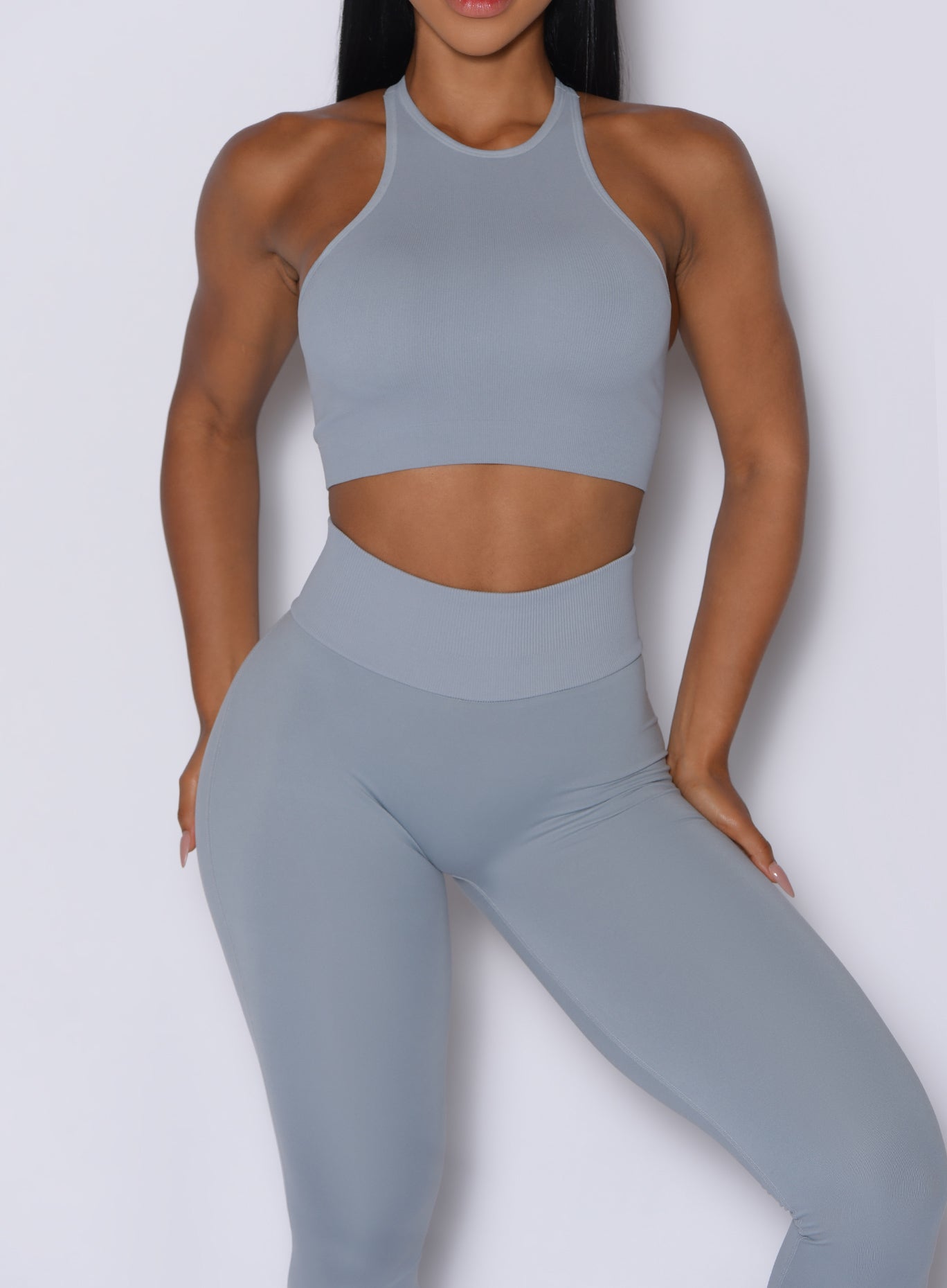 Close up front profile shot of our model wearing the Figure Scrunch Leggings in Carbon color