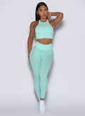 Front profile view of our model wearing the Figure Scrunch Leggings in Spring Mint color