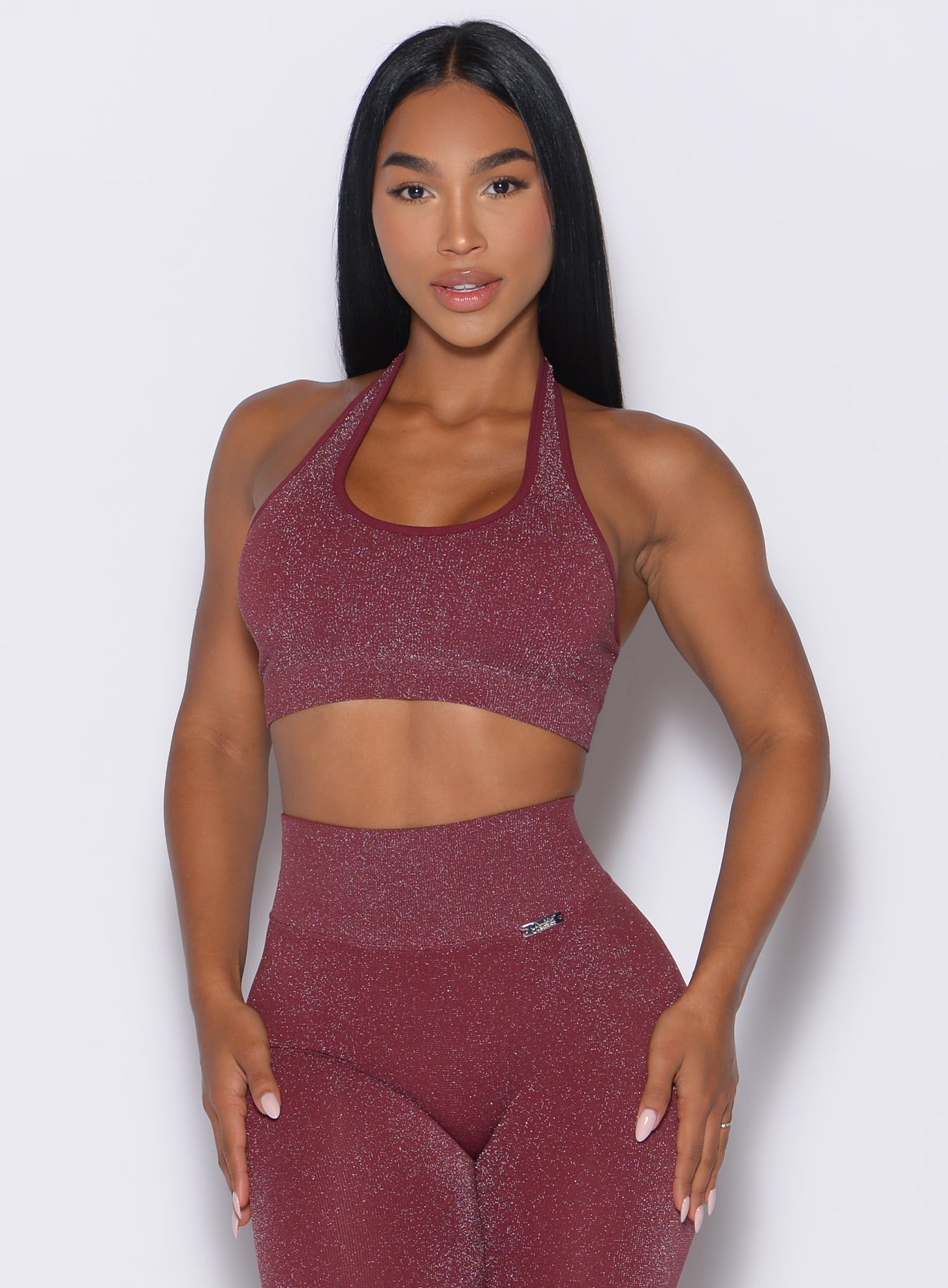 front view of a model wearing the Shimmer Backless Bra in Ruby star color