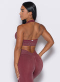 back profile view of a model wearing the Shimmer Backless Bra in Ruby star color