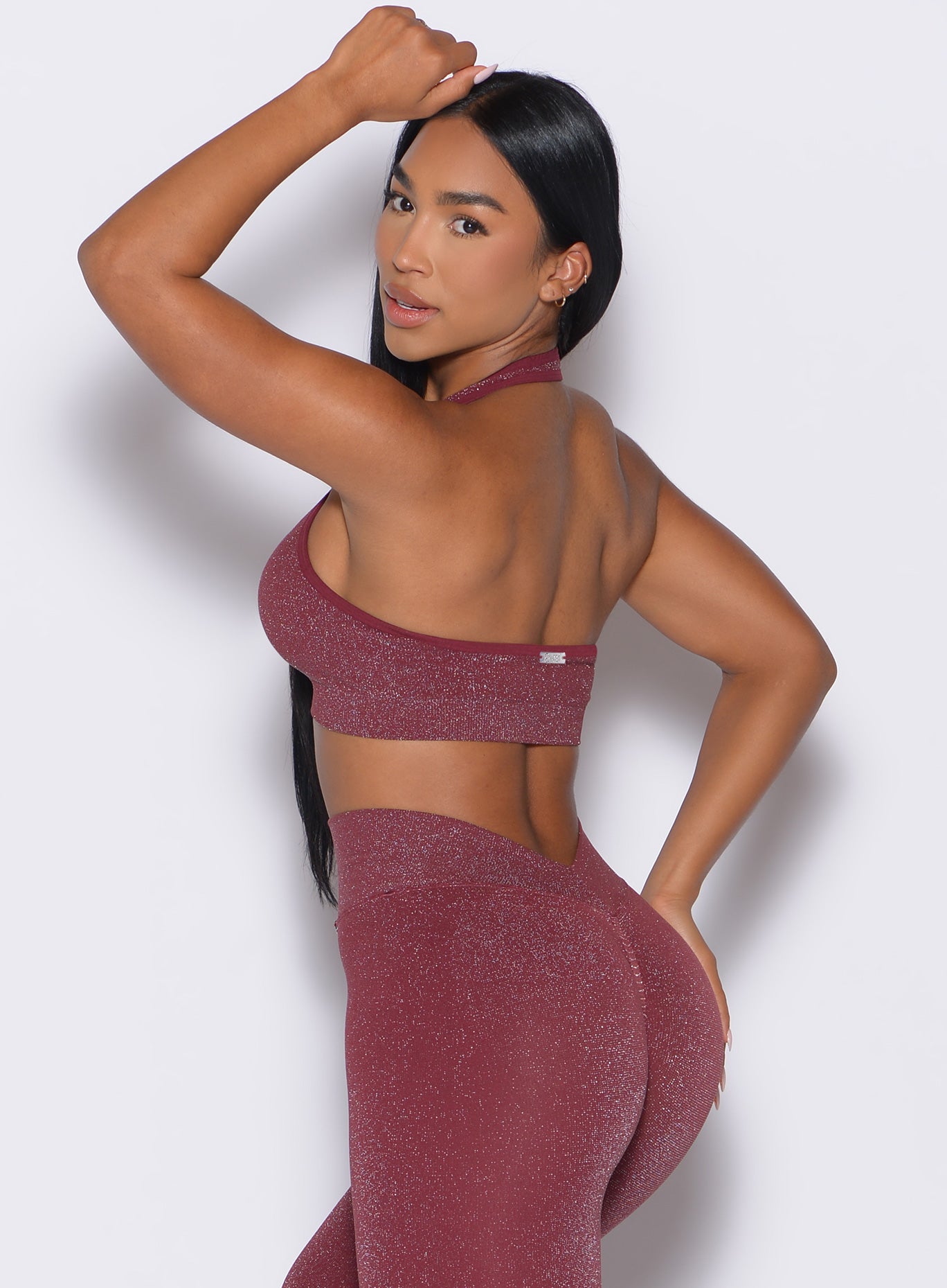 back left side profile view of a model wearing the Shimmer Backless Bra in Ruby star color