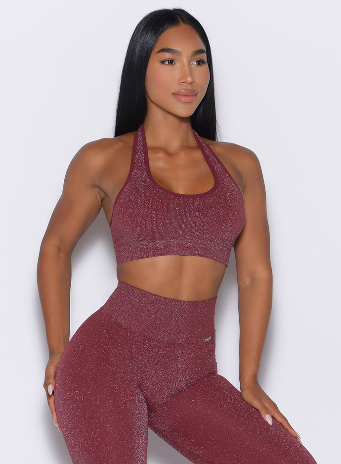 front profile view of a model looking to the left side wearing the Shimmer Backless Bra in Ruby star color