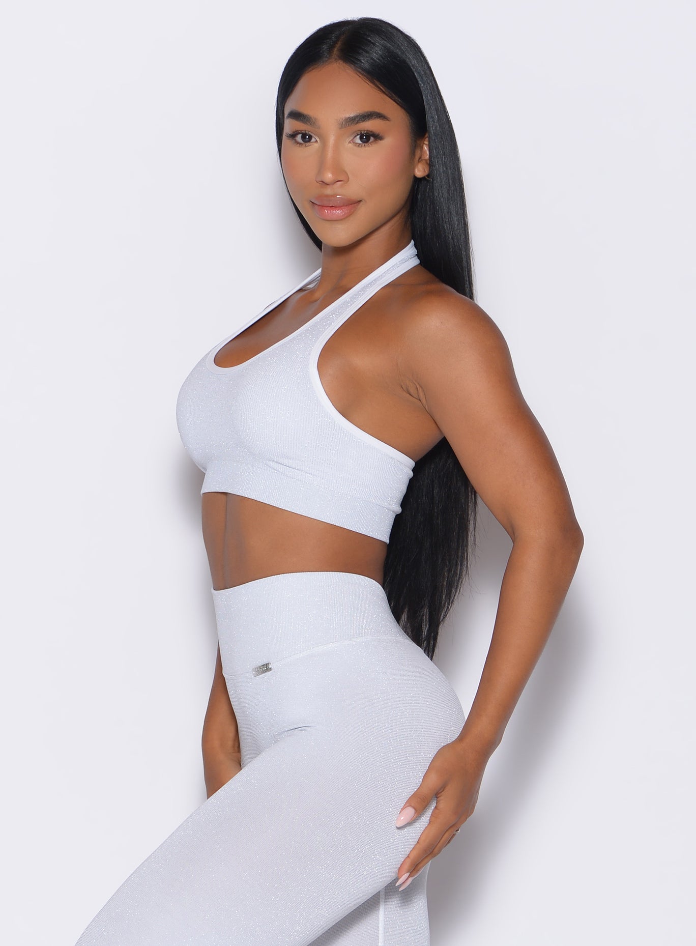 left side profile view of a model wearing the Shimmer Backless Bra in White star color