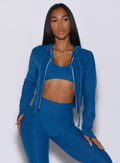 Front profile view of a model wearing our signature jacket along with the matching bra and cloud leggings 