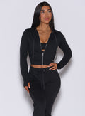 front view of model in zip front signature jacket and matching cozy black joggers