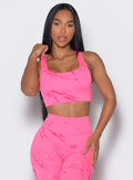 Front profile view of our model wearing the Square Neck Bra in cotton candy skies color along with the matching leggings 