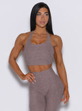 front profile picture of a model wearing our viral tank bra in london fog color along with the matching leggings