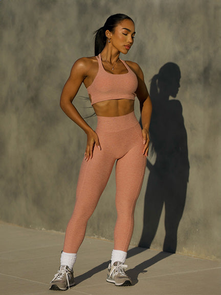 front view of model wearing pink nude legging set