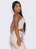 right side profile view of our model wearing the Sugar Tank Bra in champagne color