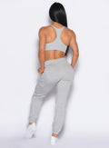 back profile view of our model wearing the Sweat Joggers in Light Heather grey color