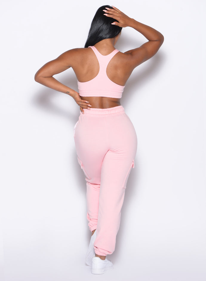 back profile view of our model wearing the Sweat Joggers in Tickled Pink color