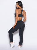 left back side profile view of our model wearing the Sweat Joggers in Vintage Black color