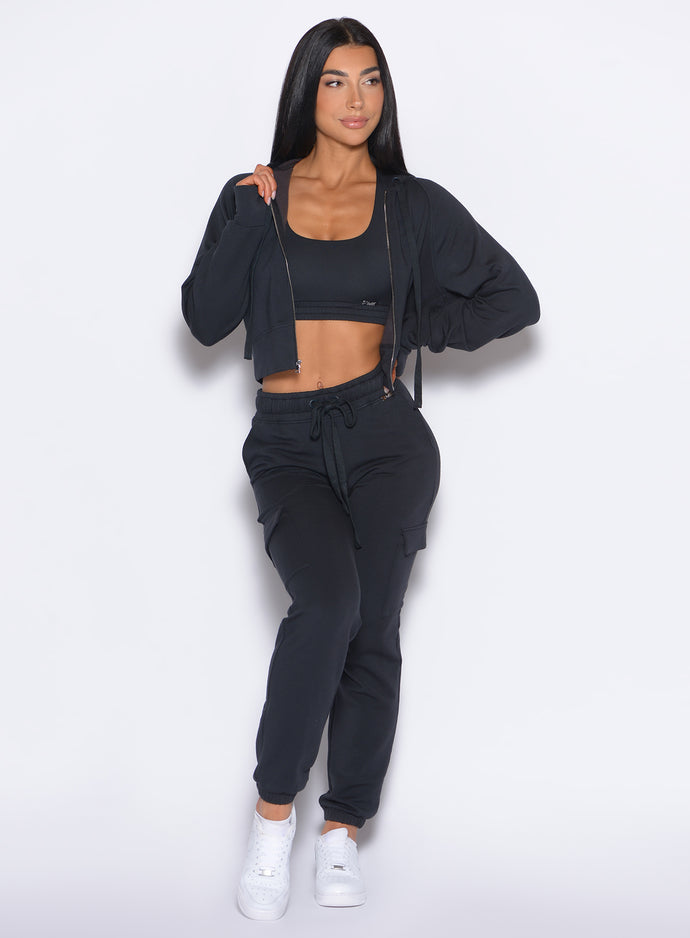 front profile view of our model wearing the Sweat Joggers in Vintage Black color paired with the matching sweat hoodie