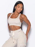 front profile view of our model wearing the Sweat Lounge Bra in Heathered Oatmeal color paired with the matching joggers