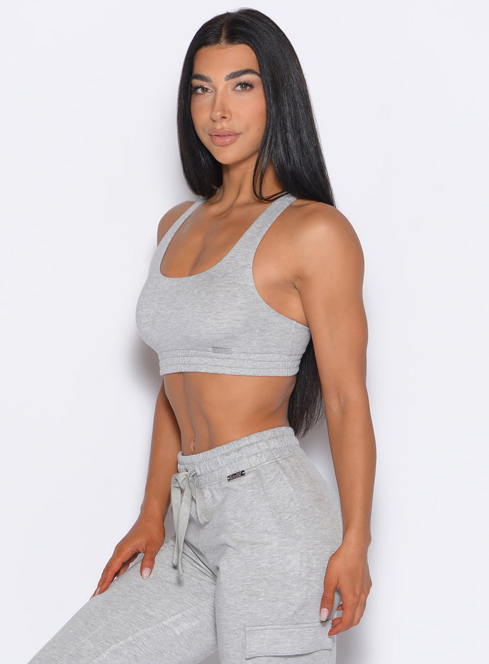 front left side profile view of our model wearing the Sweat Lounge Bra in Light Heather Grey color