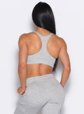 back profile view of our model wearing the Sweat Lounge Bra in Light Heather Grey color