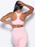 back profile view of our model wearing the Sweat Lounge Bra in Tickled Pink color