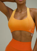 front close up of toggle sports bra in ombre