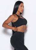 right side profile view of our model wearing the Two Way Bra in Black color