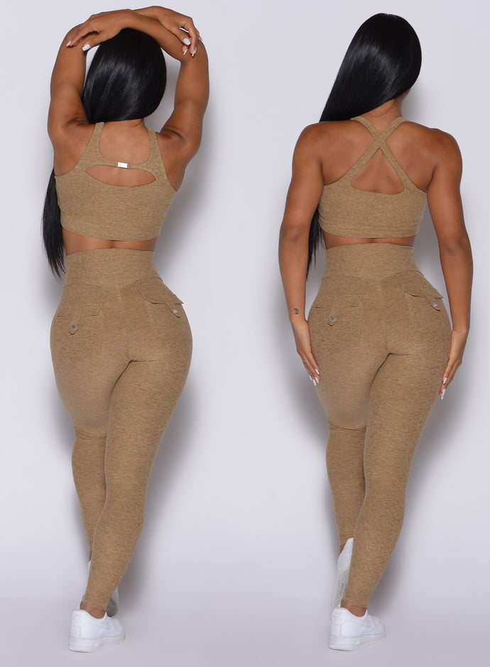 two back profile pictures of a model wearing our pocket pop leggings in caramel color and a matching two way bra 