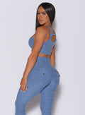 Left side profile view of a model in our two way bra in sky blue color and a matching leggings