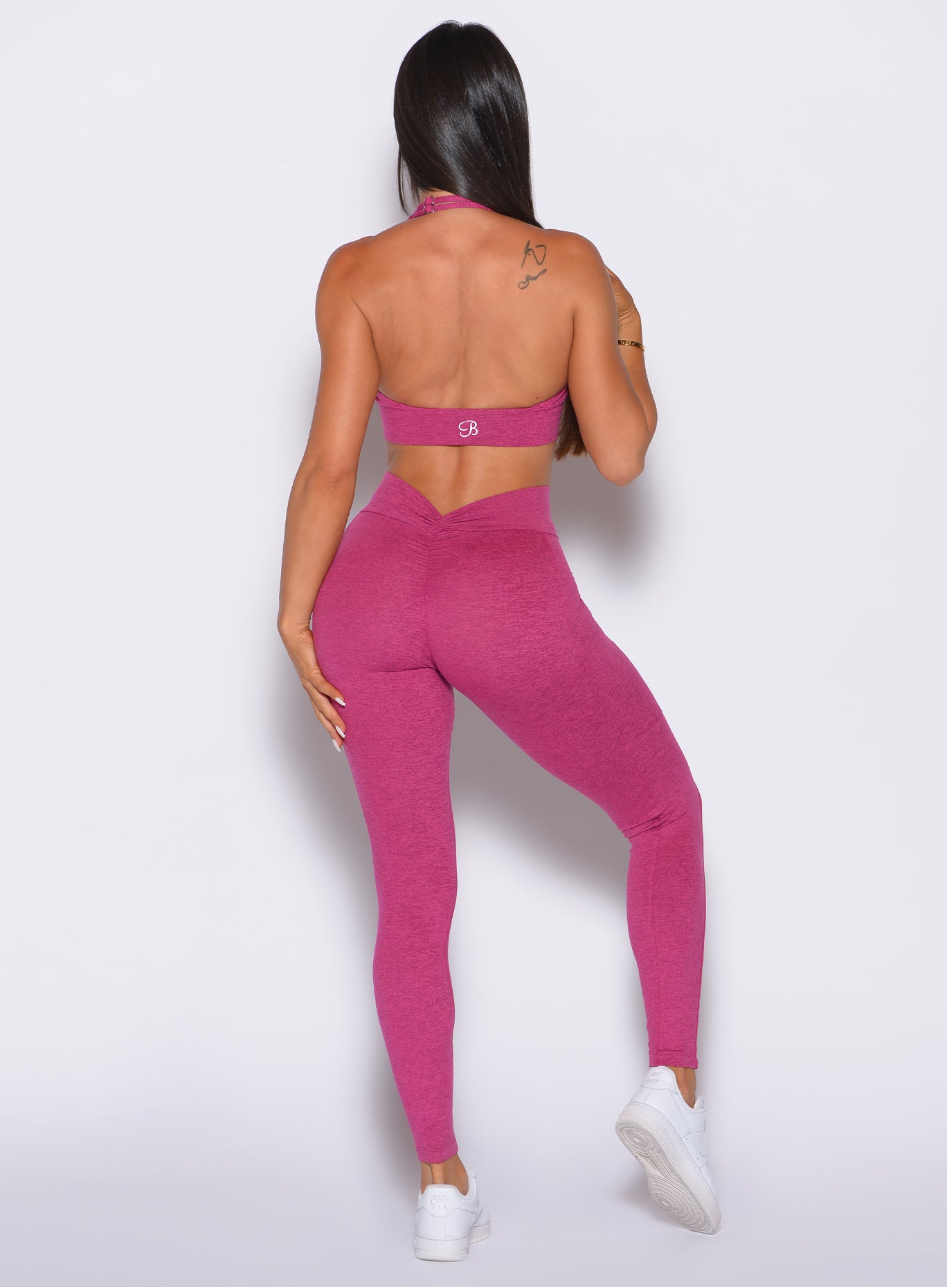 back shot of model in our v back leggings