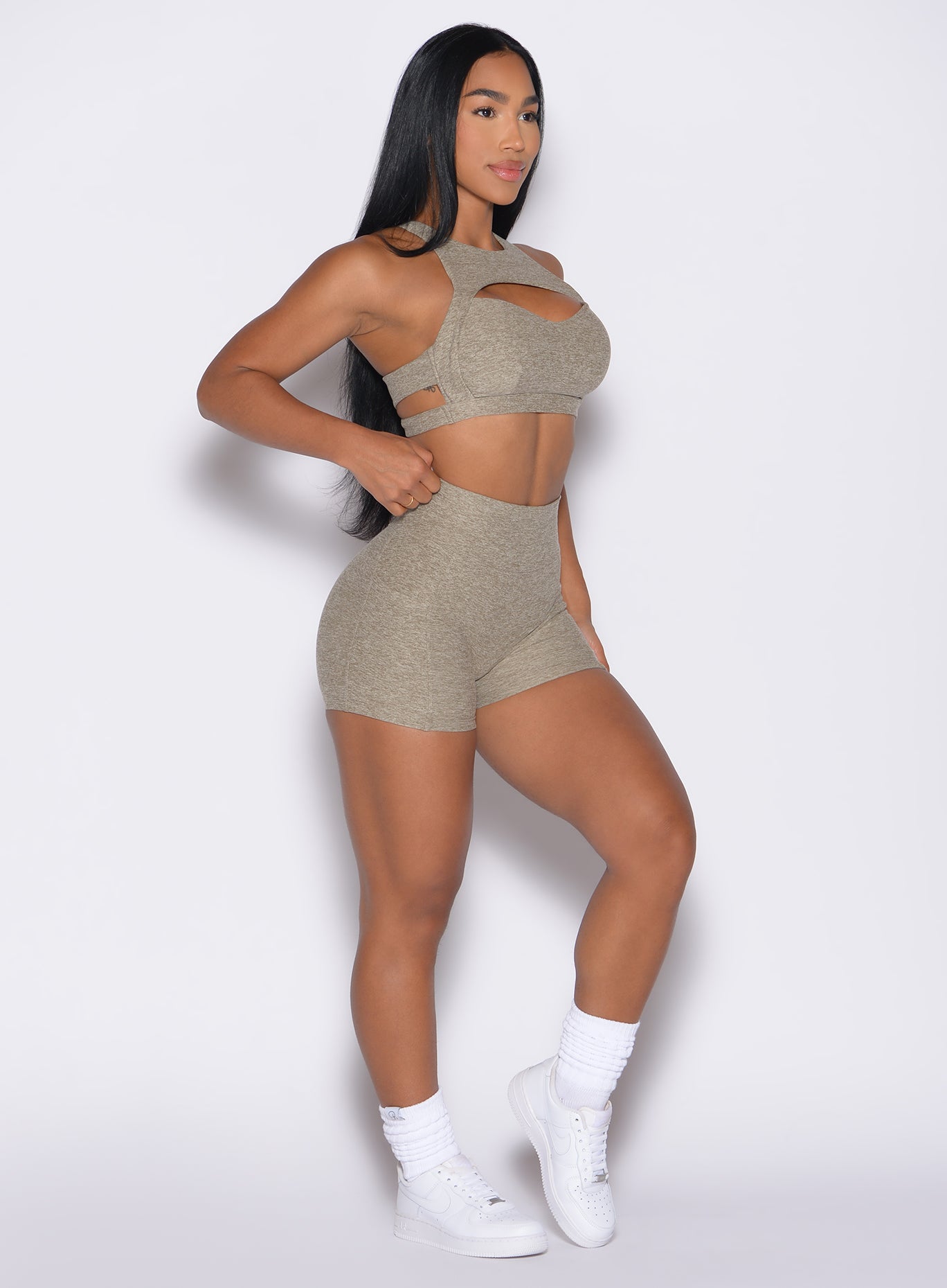 front right side profile view of a model wearing the V Back Shorts in toasted Sugar color