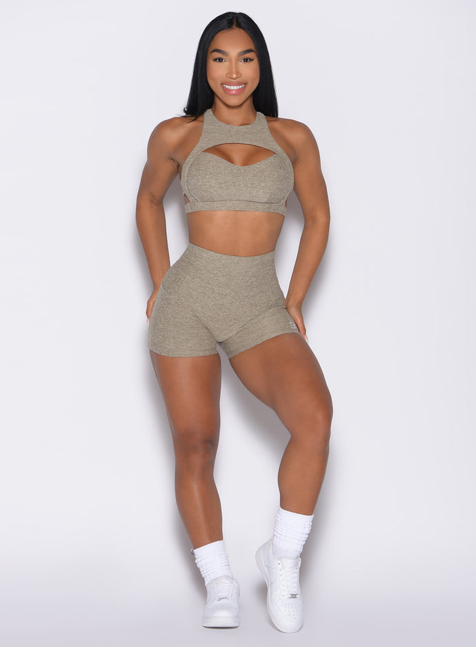 front profile view of a model wearing the V Back Shorts in toasted Sugar color paired with the matching bra