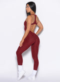 right side profile view of our model wearing the Athletic Bodysuit in Black Cherry color