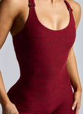 close up front profile shot of our model wearing the Athletic Bodysuit in Black Cherry color