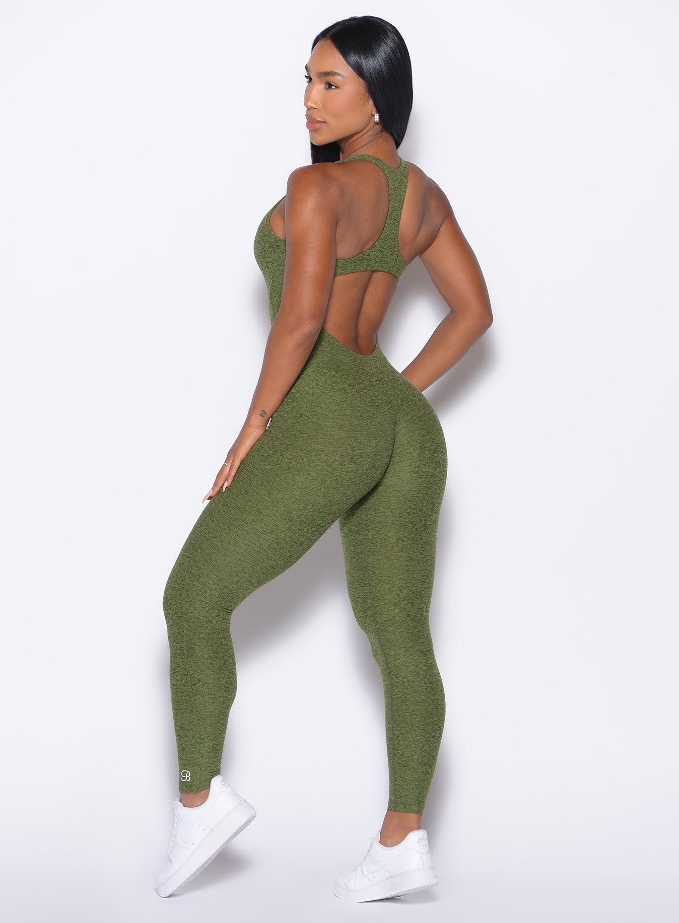 Back left side profile view of our model wearing the Athletic Bodysuit in Juniper color