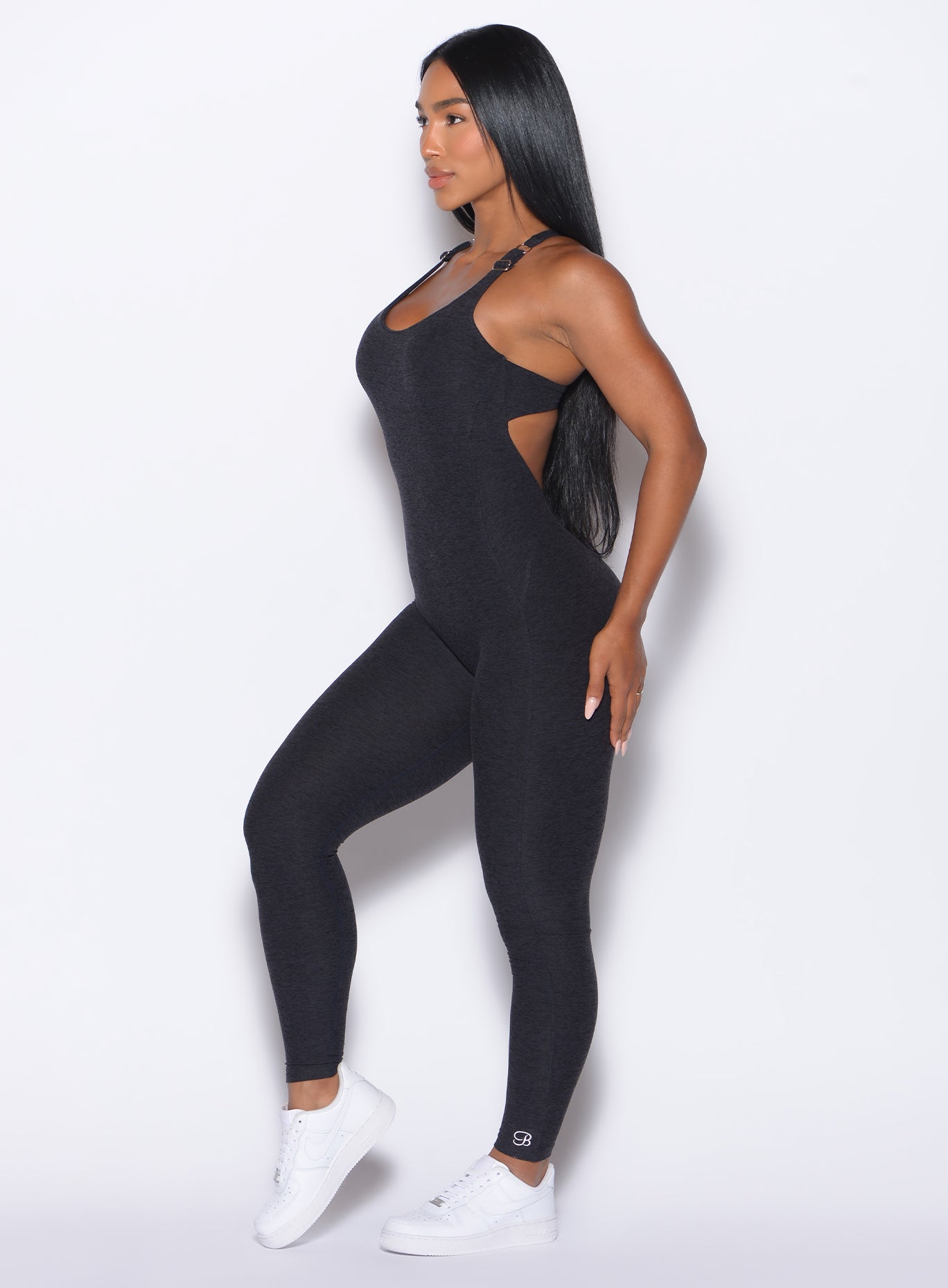 Left side profile view of our model wearing the Athletic Bodysuit in Onyx color