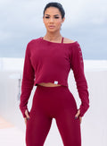 model in outdoors wearing the Allure Pullover in red velvet color