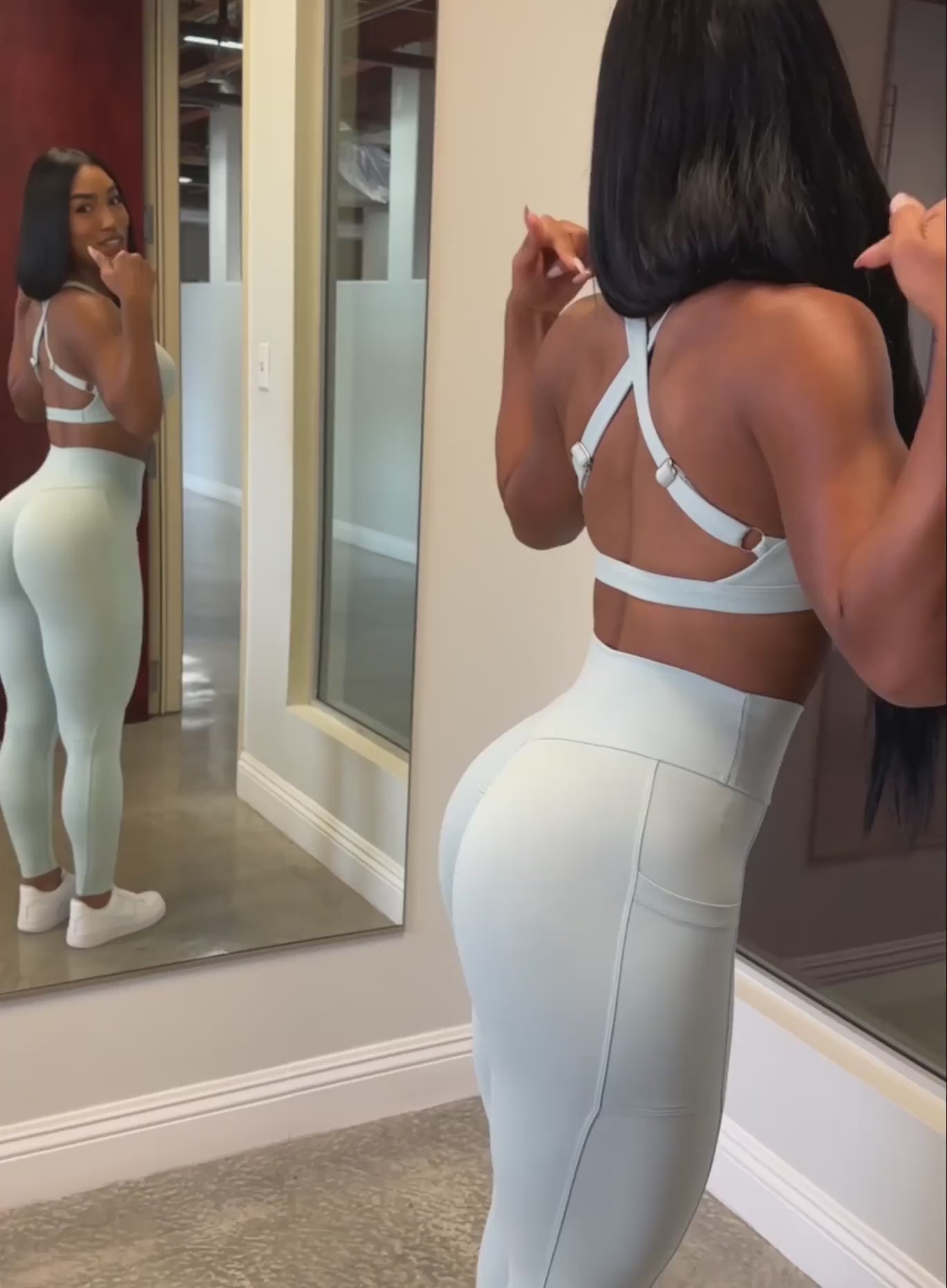 A video featuring our model showcasing her outfit wearing the Sweetheart Sports Bra in Mist color and the matching leggings 