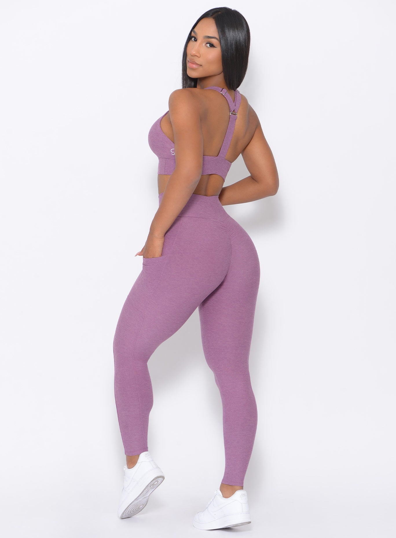 Back view of the model in our lavender curves high waist leggings