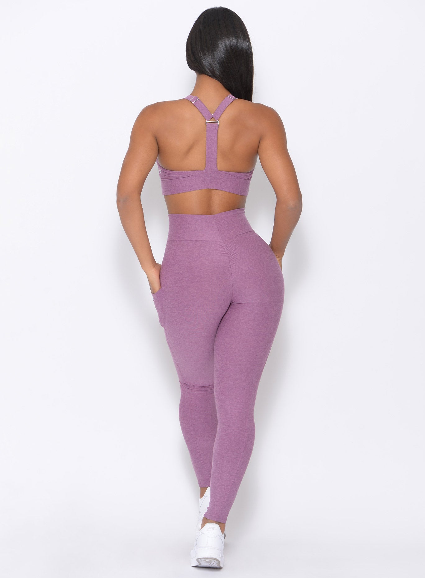back profile of model wearing our lavender curves high waist leggings
